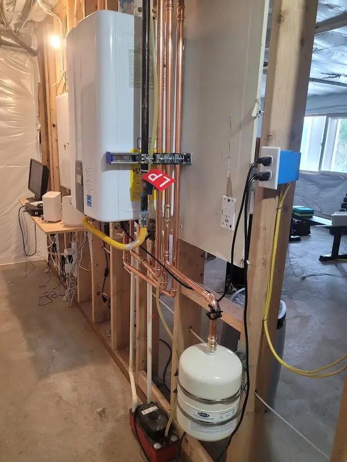 Licensed plumber repairing a kitchen sink in Carrollton